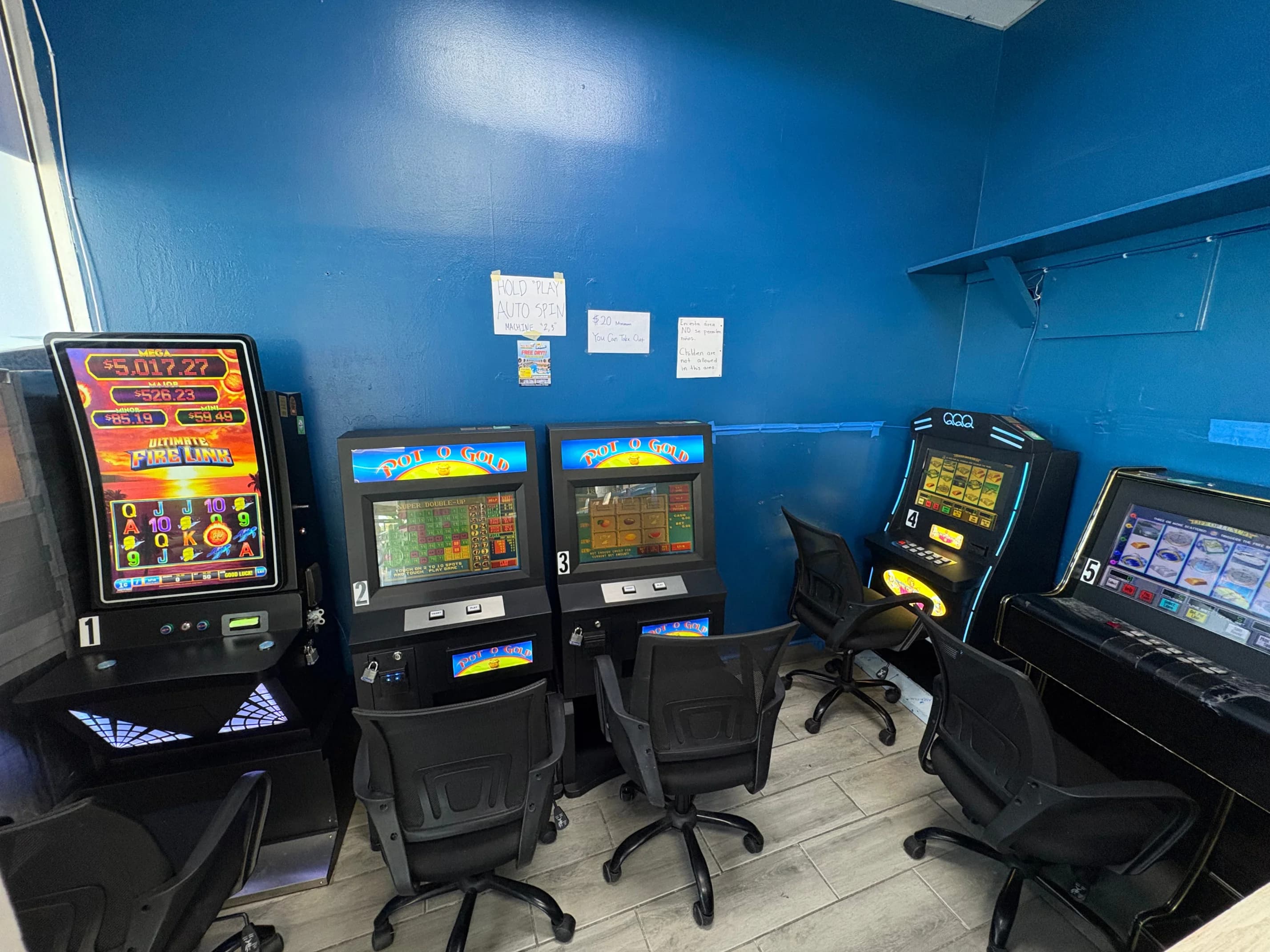 Row of slot-style game machines at the washateria