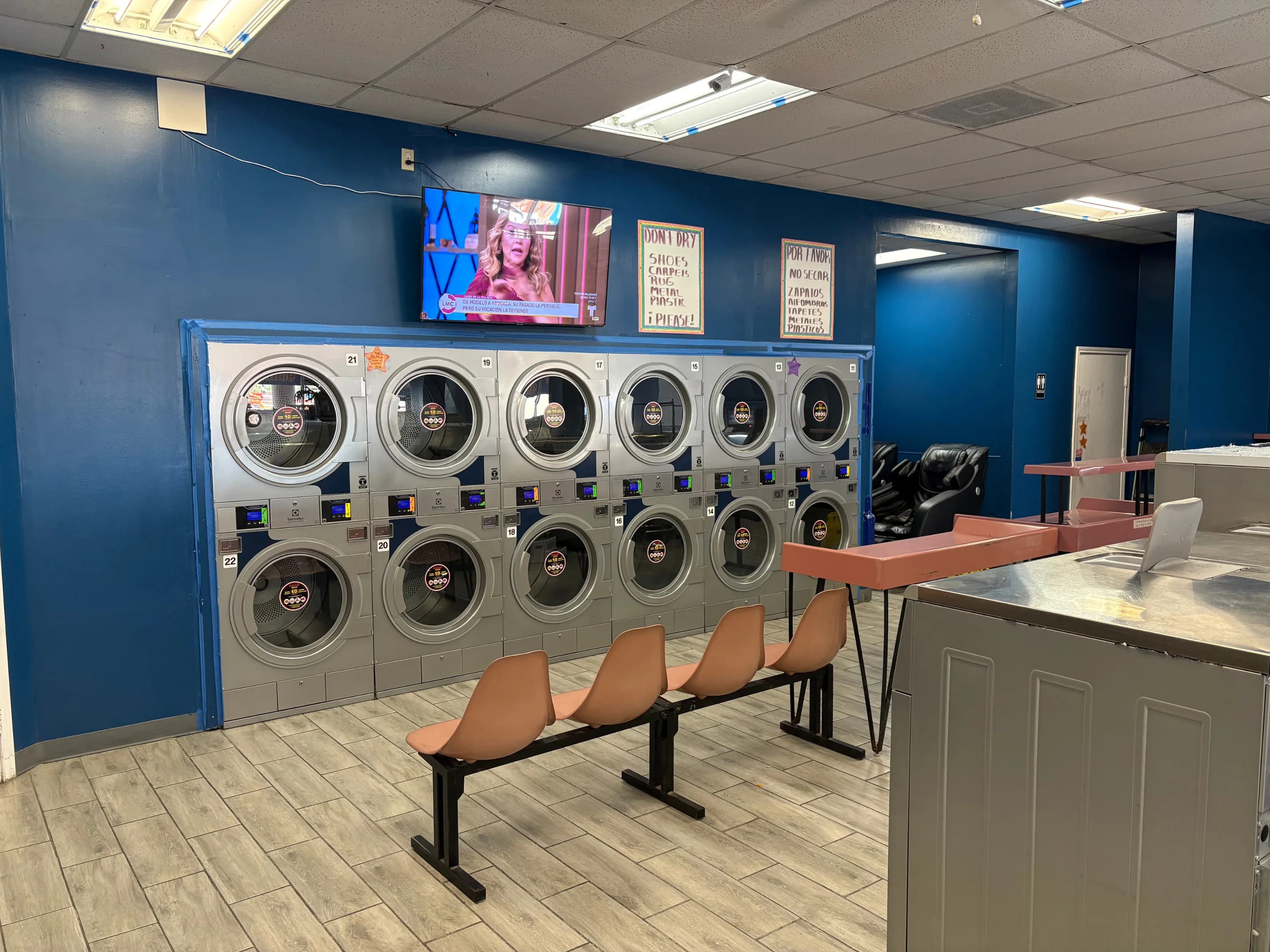 Laundry drying tumblers inside the washateria